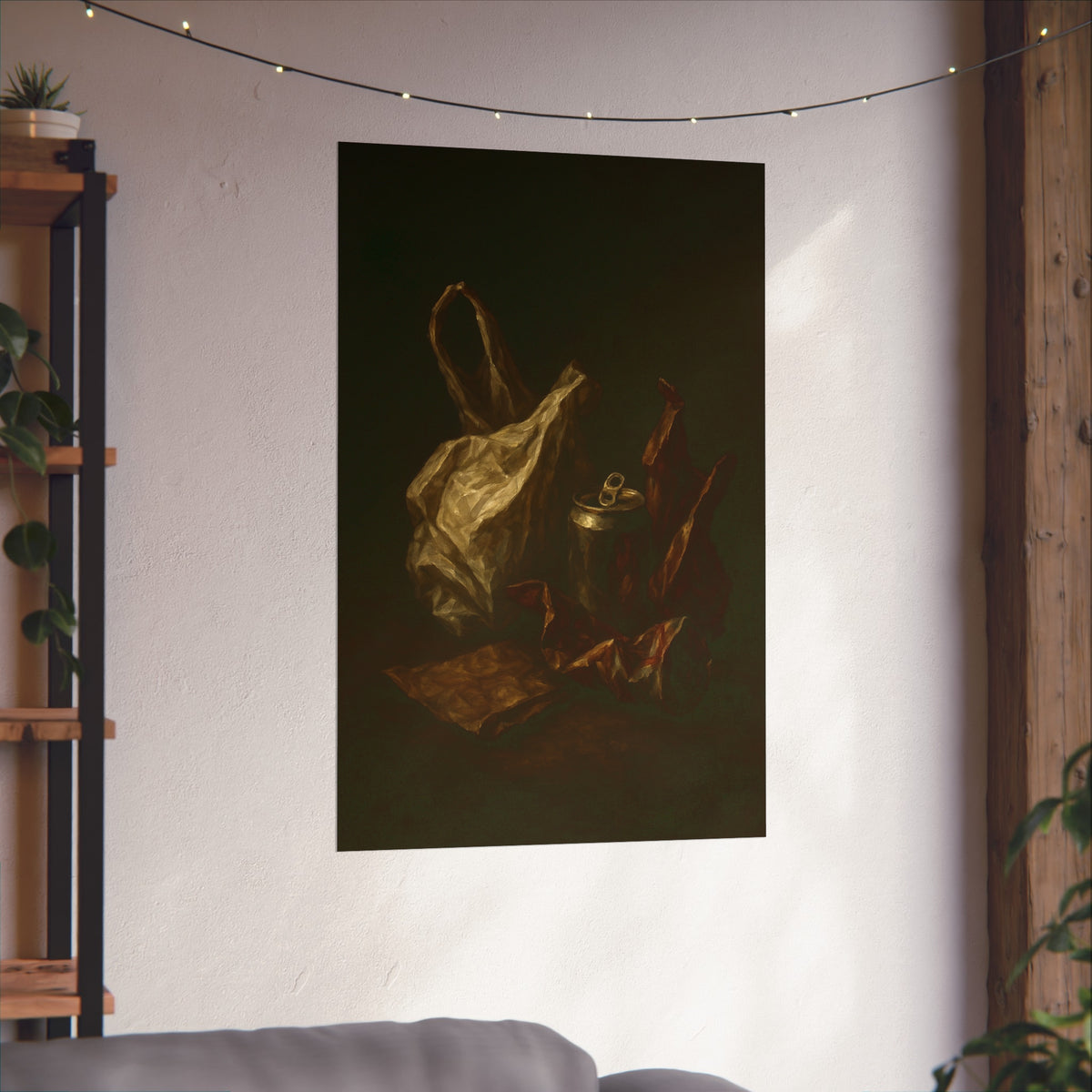 A crumpled plastic bag, crushed can and foil wrappers on a dark table. The Pietà of the Deflated by Garabaggio, fine art print hanging in a room.