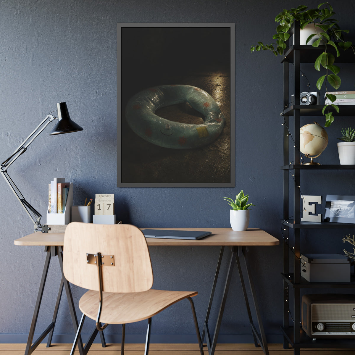 Deflated pool float ring on wet ground, lit from one side in the dark. After the Last Swim by Garabaggio, framed fine art print hanging in a room.