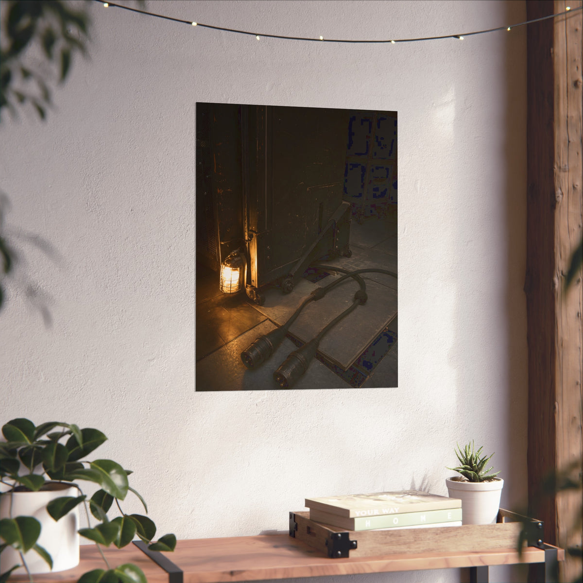 Two thick power cables unplugged on the floor beside a caged work lamp. The Redundant Power by Garabaggio, fine art print hanging in a room.