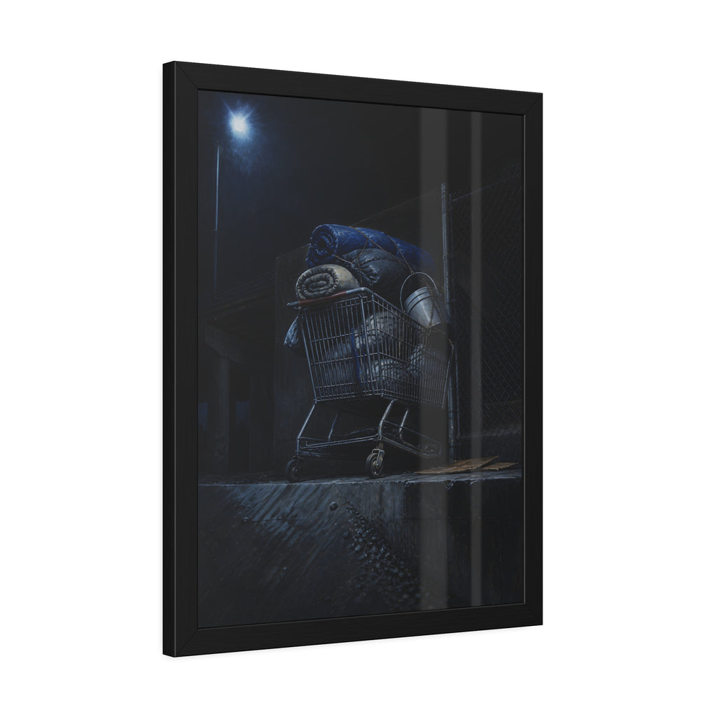 A shopping cart piled with bedding and buckets under a streetlamp. The Loading of Another Life by Garabaggio, framed fine art print hanging in a room.