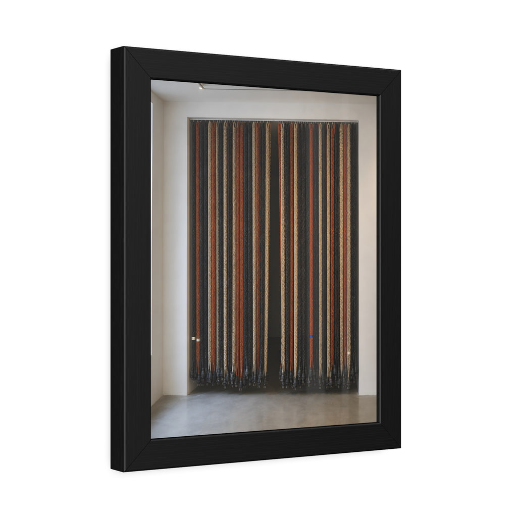 Hundreds of extension cords hung floor to ceiling across a bright white room. The Cord Curtain by Garabaggio, framed fine art print hanging in a room.