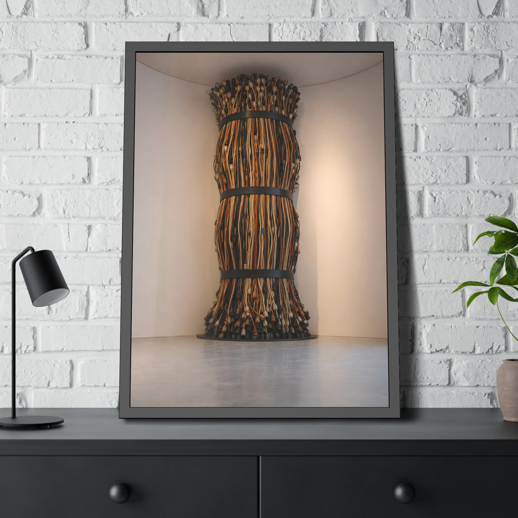 A tall column of bundled cords strapped in three places in a gallery corner. The Bundled Apse by Garabaggio, framed fine art print hanging in a room.