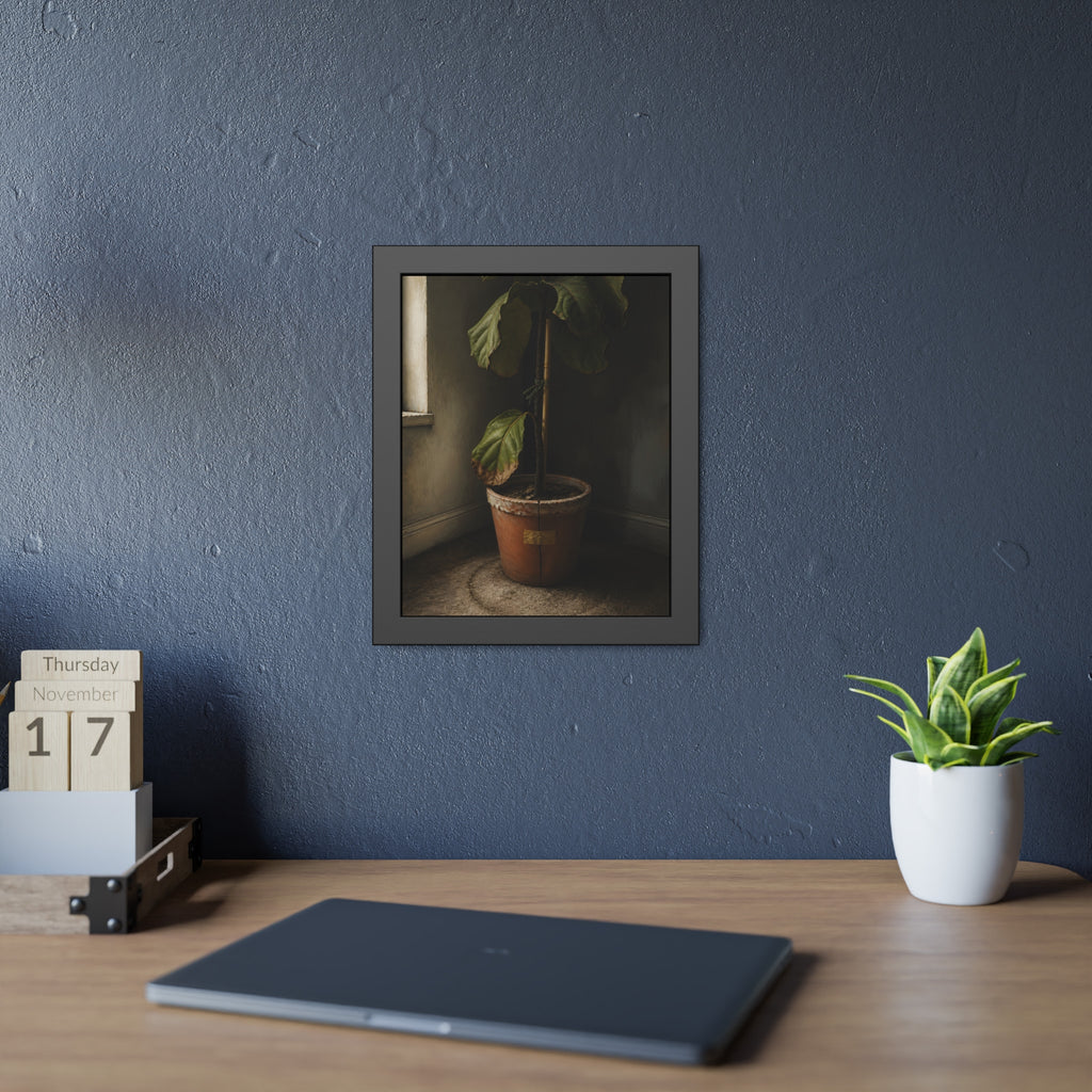 A leafy potted fig staked to a cane in a taped clay pot beside a window. The Corner by the Window by Garabaggio, framed fine art print hanging in a room.