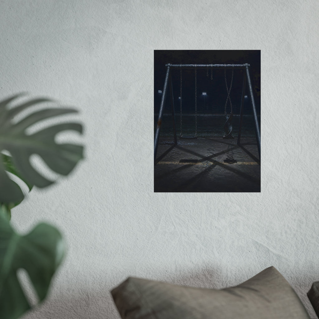An empty swing set at night with one seat twisted up on its chains. The First Hour: The Twisted Seat by Garabaggio, fine art print hanging in a room.