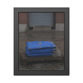 A folded blue tarp stacked on a low wooden platform by a loading dock. The Repaired Fold by Garabaggio, framed fine art print, 11″ x 14″.
