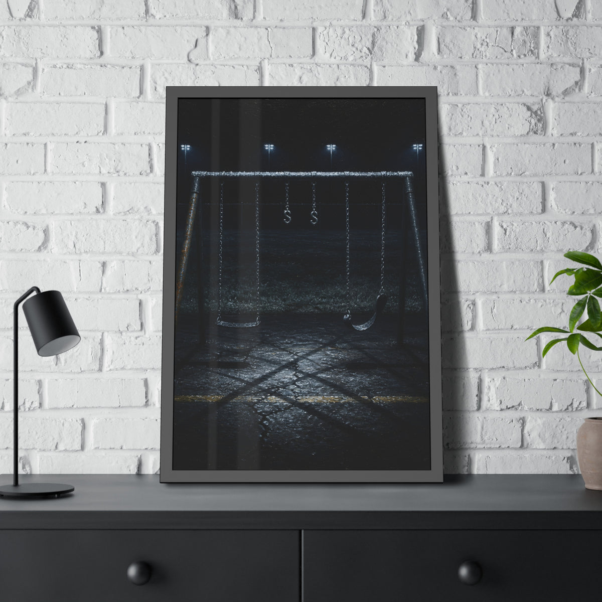 An empty swing set with frost on its crossbar under floodlights. Midnight: The Frost on the Crossbar by Garabaggio, framed fine art print hanging in a room.