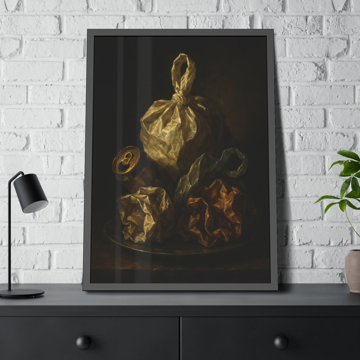 Knotted plastic bag on a plate with crumpled wrappers and a crushed can. Communion of the Knotted Bag by Garabaggio, framed fine art print hanging in a room.