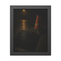 A traffic cone beside a fresh asphalt patch under a street lamp. The Sentinel After Repair by Garabaggio, framed fine art print, 11″ x 14″.