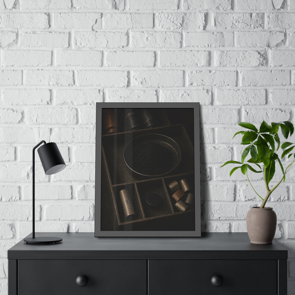 Battery casings and black powder sorted into the trays of a dim box. The Black Recovery by Garabaggio, framed fine art print hanging in a room.