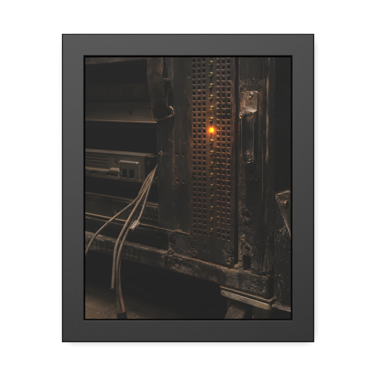 A single amber light among green LEDs on a grimy server rack. The Amber Fault by Garabaggio, framed fine art print, 11″ x 14″.