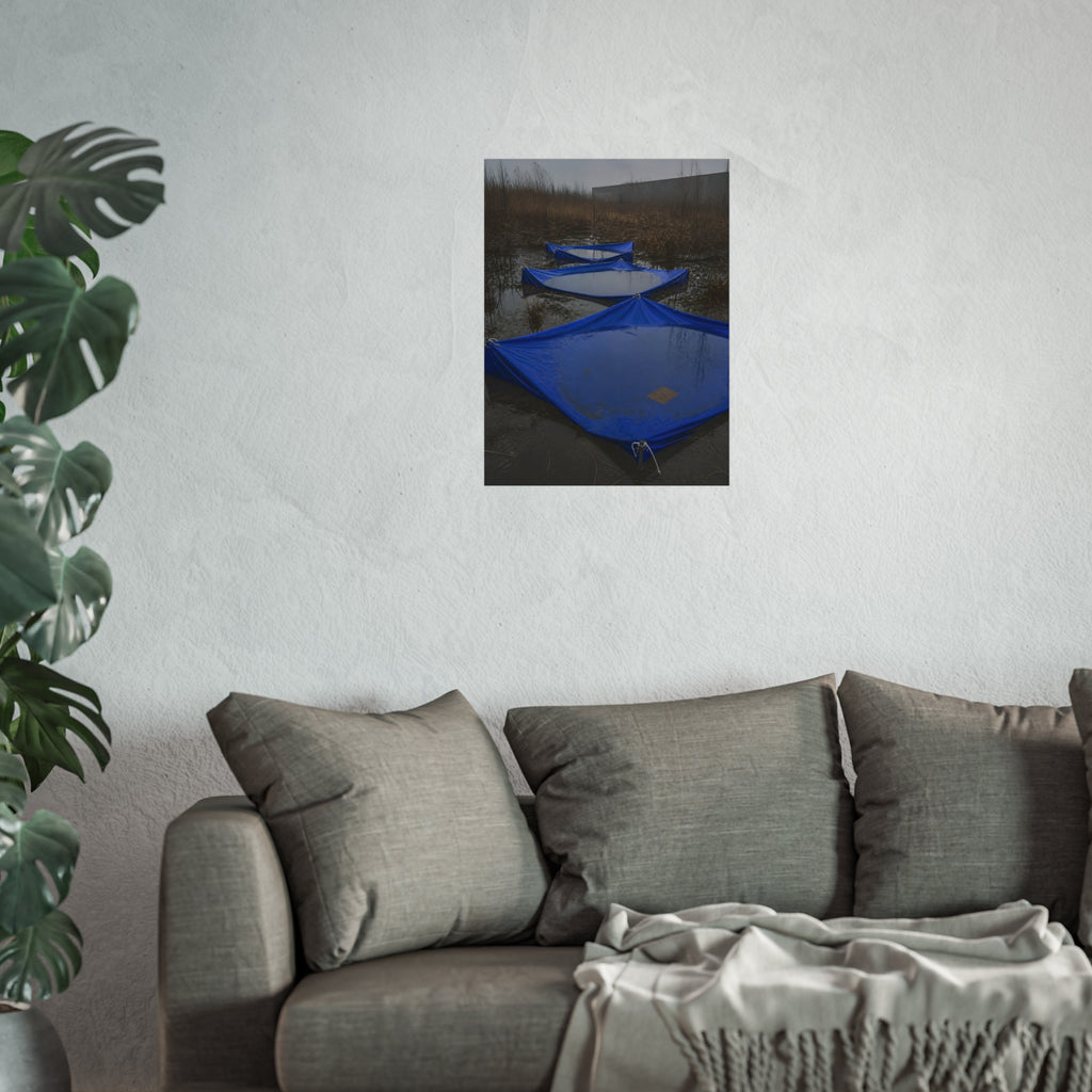 Three blue tarps holding pooled rainwater in a weedy vacant lot. Flooded in the Vacant Lot by Garabaggio, fine art print hanging in a room.