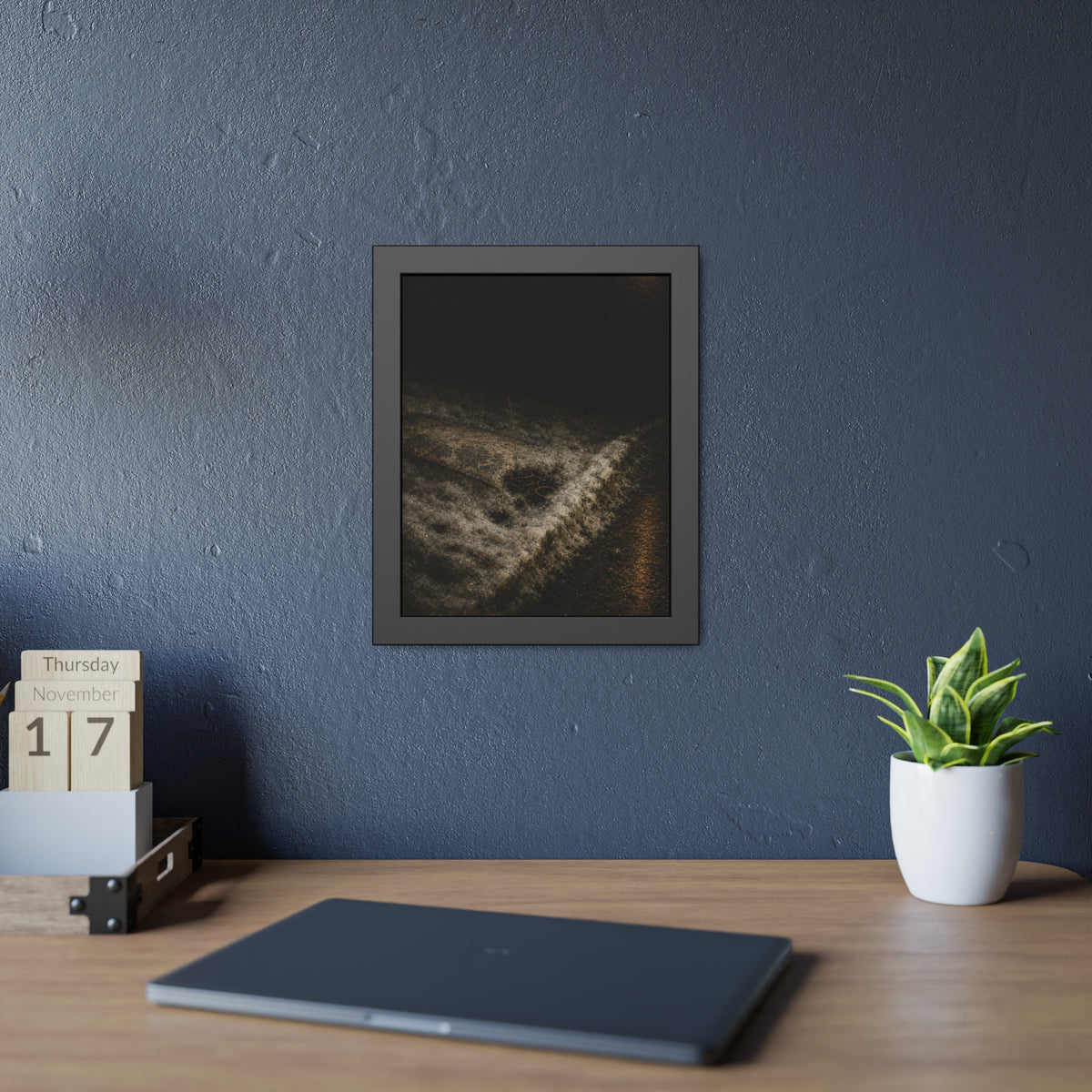 A discarded mattress half buried in snow, a distant streetlight behind. The White Burial by Garabaggio, framed fine art print hanging in a room.