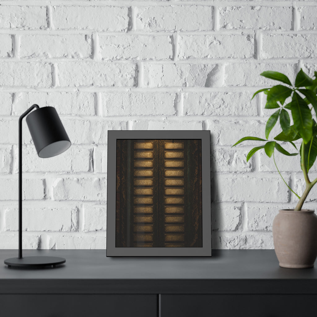 An intercom panel of blank name slots on a weathered building wall. The Names Behind Brass by Garabaggio, framed fine art print hanging in a room.
