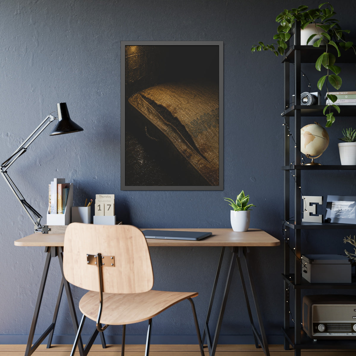 A mattress with its seam split open, lit warm against a dark wall. The Opening of the Ticking by Garabaggio, framed fine art print hanging in a room.