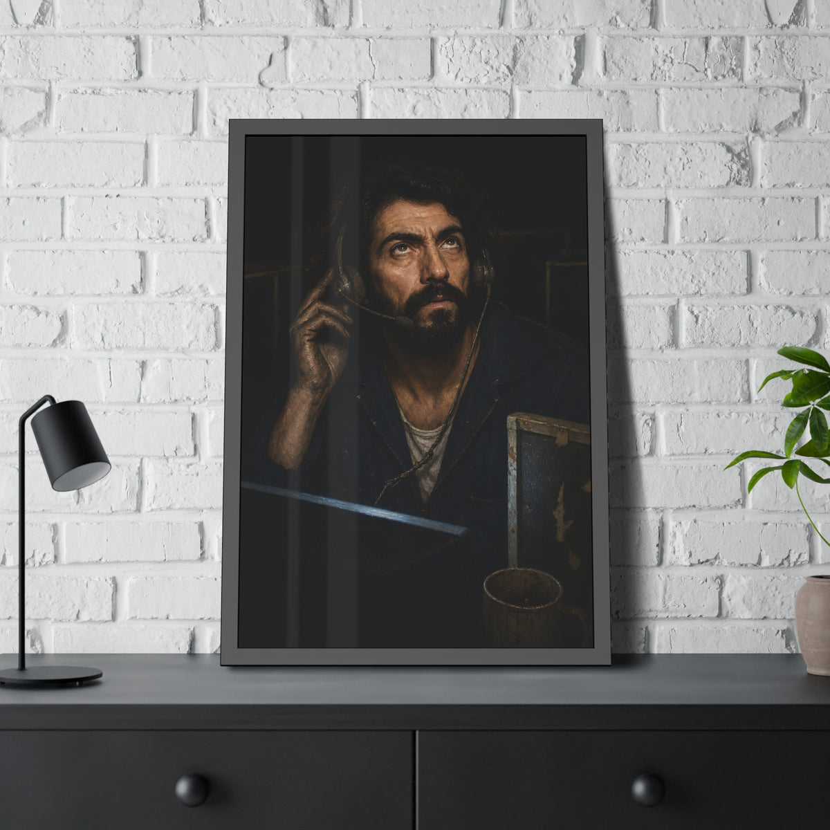 A man in a phone headset looks upward over the glow of a monitor. Garabaggio on Hold by Garabaggio, framed fine art print hanging in a room.