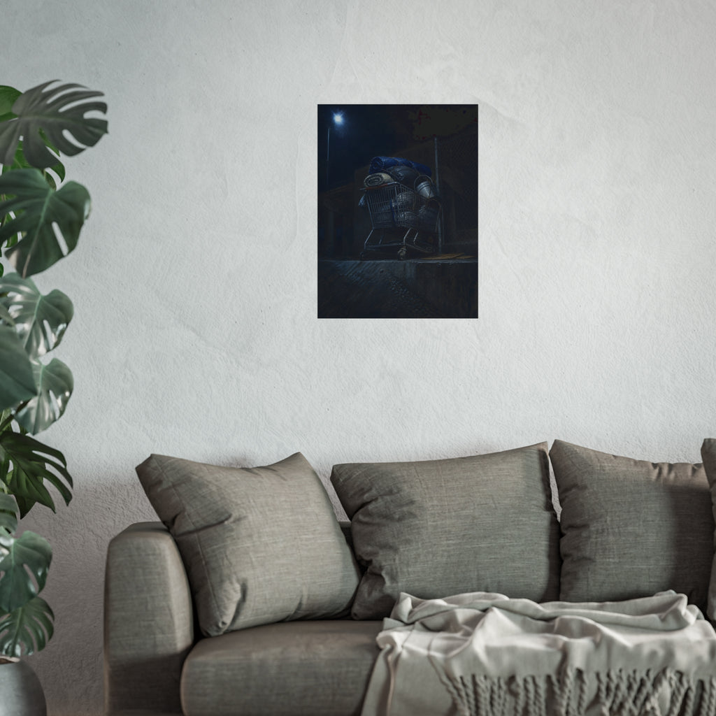 A shopping cart piled with bedding and buckets under a streetlamp. The Loading of Another Life by Garabaggio, fine art print hanging in a room.