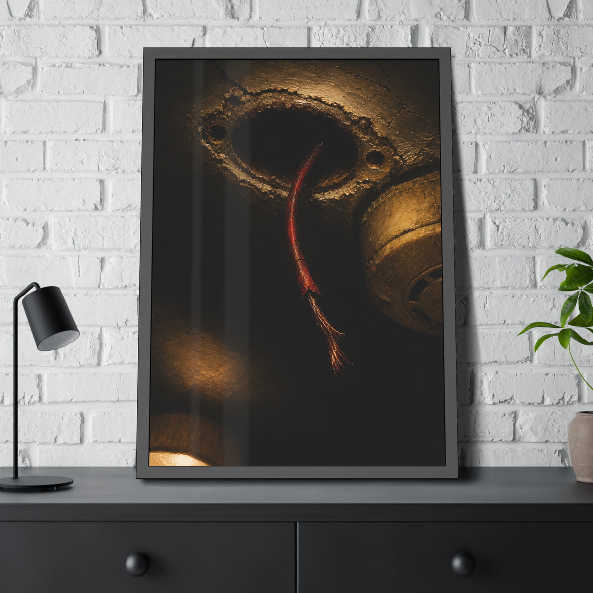 A frayed red wire hanging from a hole in a cracked ceiling. The Loose Red Wire by Garabaggio, framed fine art print hanging in a room.
