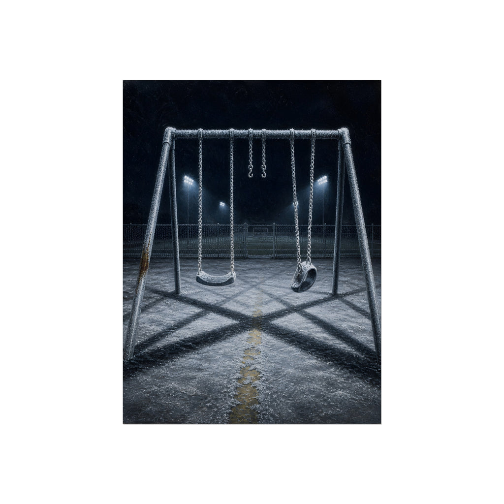 A frost covered swing set on empty asphalt under distant floodlights. The Third Hour: The Coldest Part by Garabaggio, fine art print, 12″ x 16″.