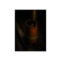 An upturned traffic cone holding rainwater at a wet curb under a lamp. The Cup of Rain by Garabaggio, fine art print, 12″ x 16″.