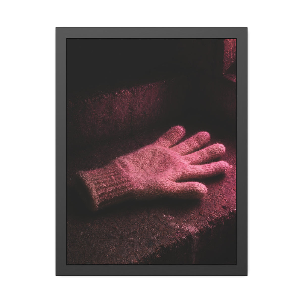 A knitted glove lying flat on a concrete step under pink light. The Vigil in Pink Light by Garabaggio, framed fine art print hanging in a room.
