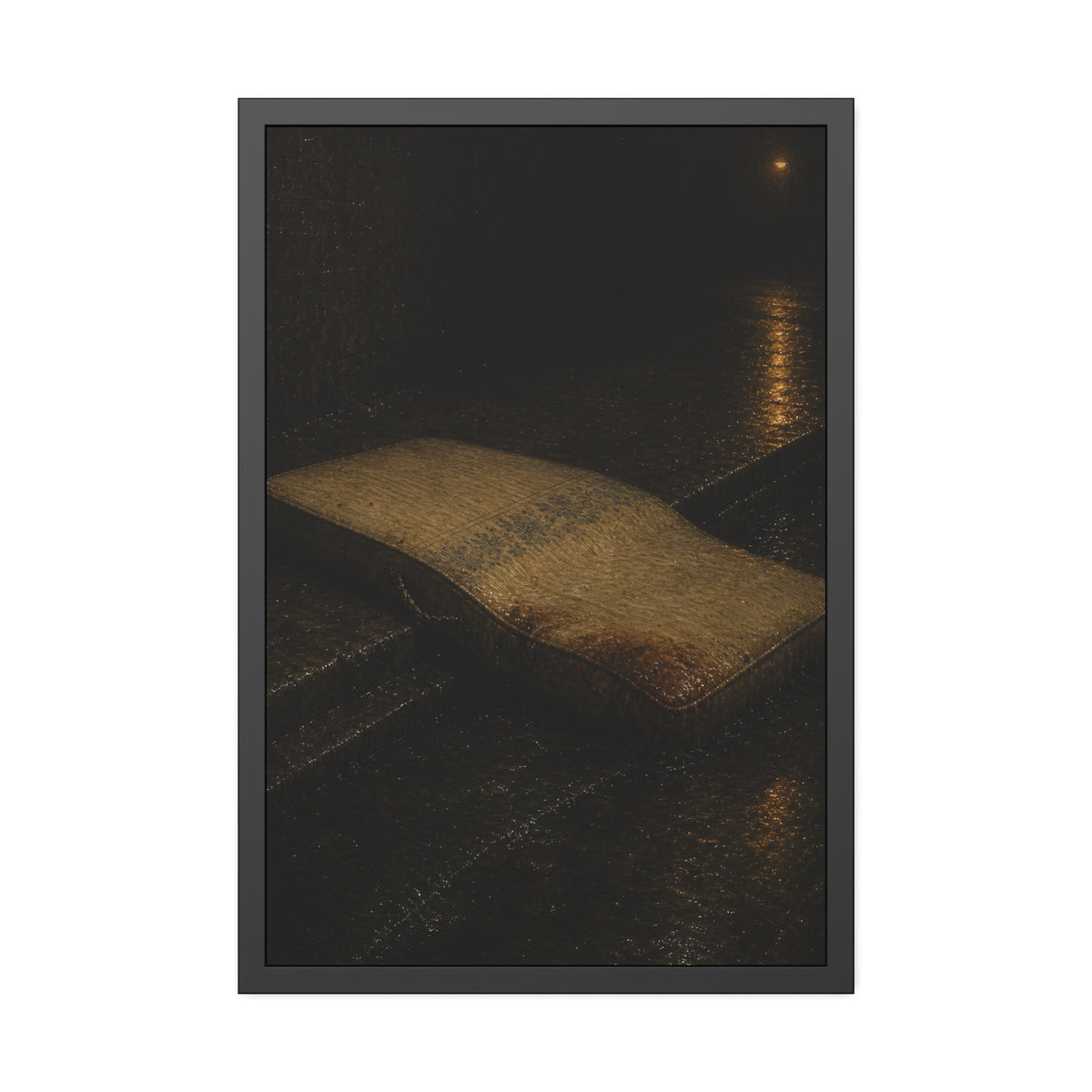 A sodden mattress slumped off a curb on wet pavement under a street lamp. The Collapse into the Gutter by Garabaggio, framed fine art print, 24″ x 36″.