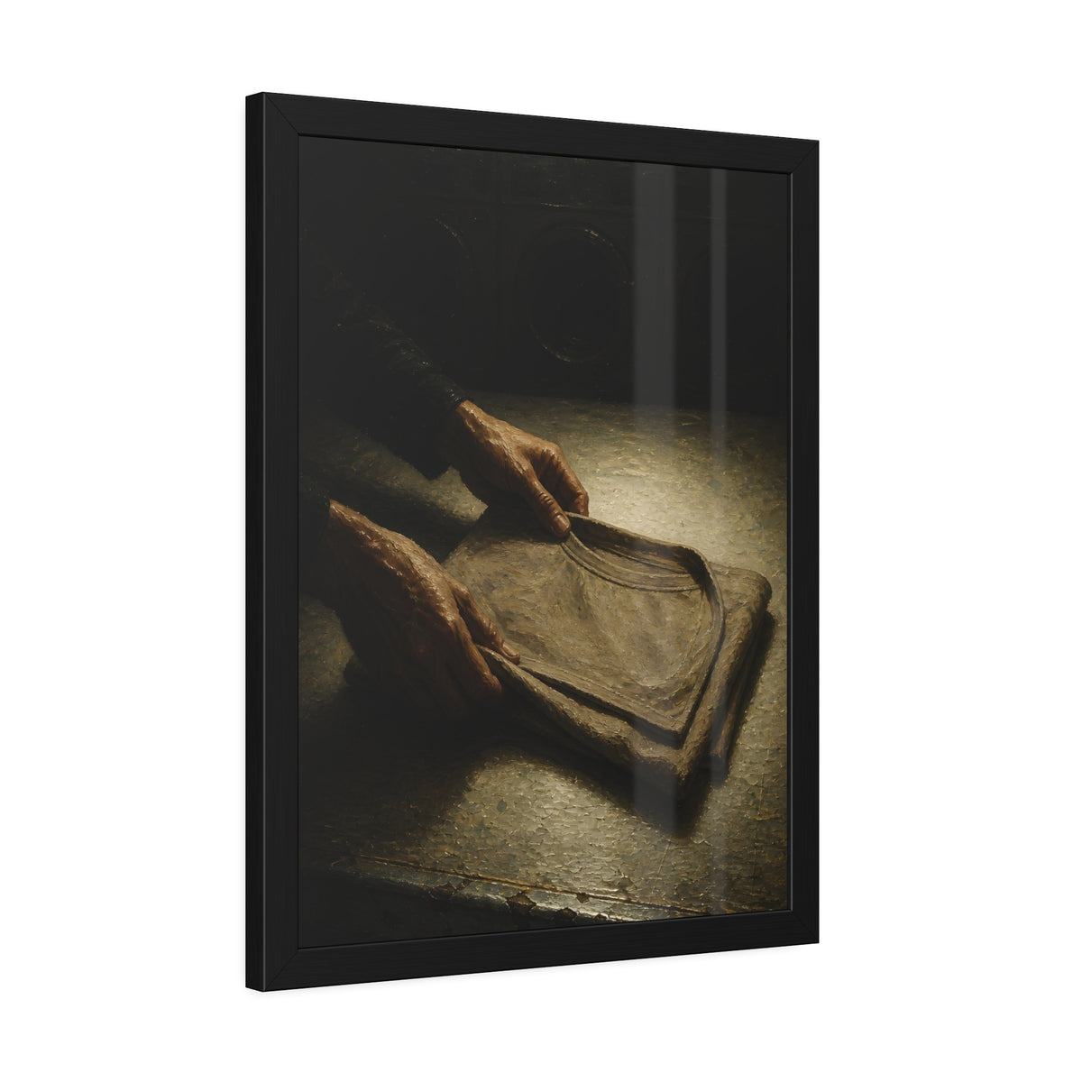 Two hands folding a shirt on a laundromat table with washers behind. The Folding at Two A.M by Garabaggio, framed fine art print hanging in a room.