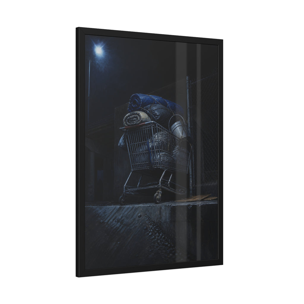 A shopping cart piled with bedding and buckets under a streetlamp. The Loading of Another Life by Garabaggio, framed fine art print hanging in a room.