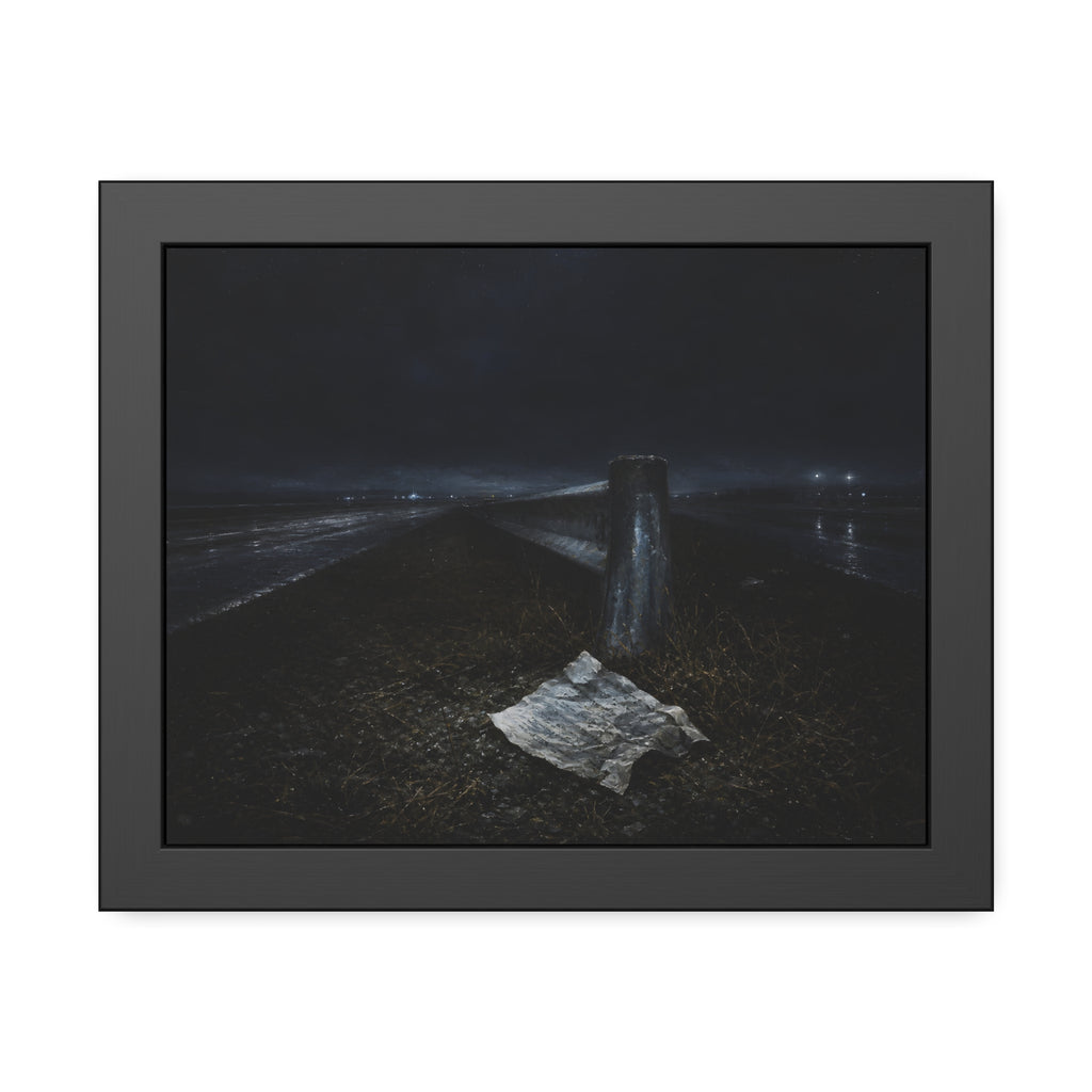 A sheet of paper on a grassy highway median beside a concrete post at night. The Resume on the Median by Garabaggio, framed fine art print, 14″ x 11″.