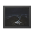 A sheet of paper on a grassy highway median beside a concrete post at night. The Resume on the Median by Garabaggio, framed fine art print, 14″ x 11″.