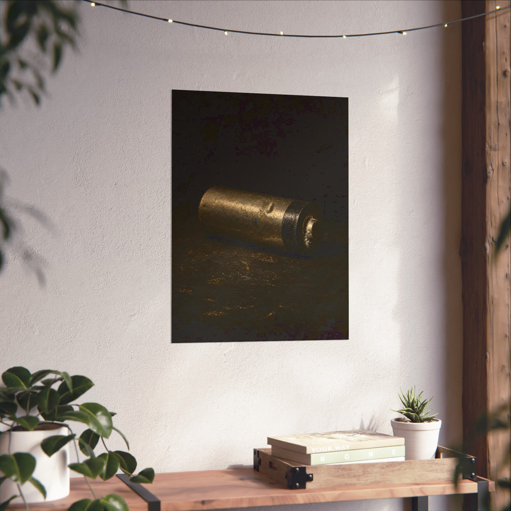 A corroded AA battery lying on a dark gritty surface in a single beam. The First Exhaustion by Garabaggio, fine art print hanging in a room.