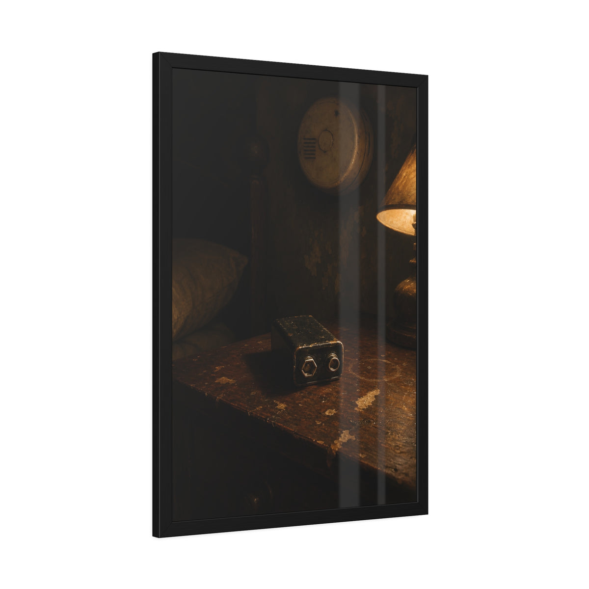 A nine volt battery on a nightstand below a wall smoke detector. The Battery Laid Below by Garabaggio, framed fine art print hanging in a room.