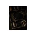 Battery casings and black powder sorted into the trays of a dim box. The Black Recovery by Garabaggio, fine art print, 12″ x 16″.