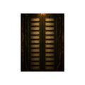 An intercom panel of blank name slots on a weathered building wall. The Names Behind Brass by Garabaggio, fine art print, 12″ x 16″.