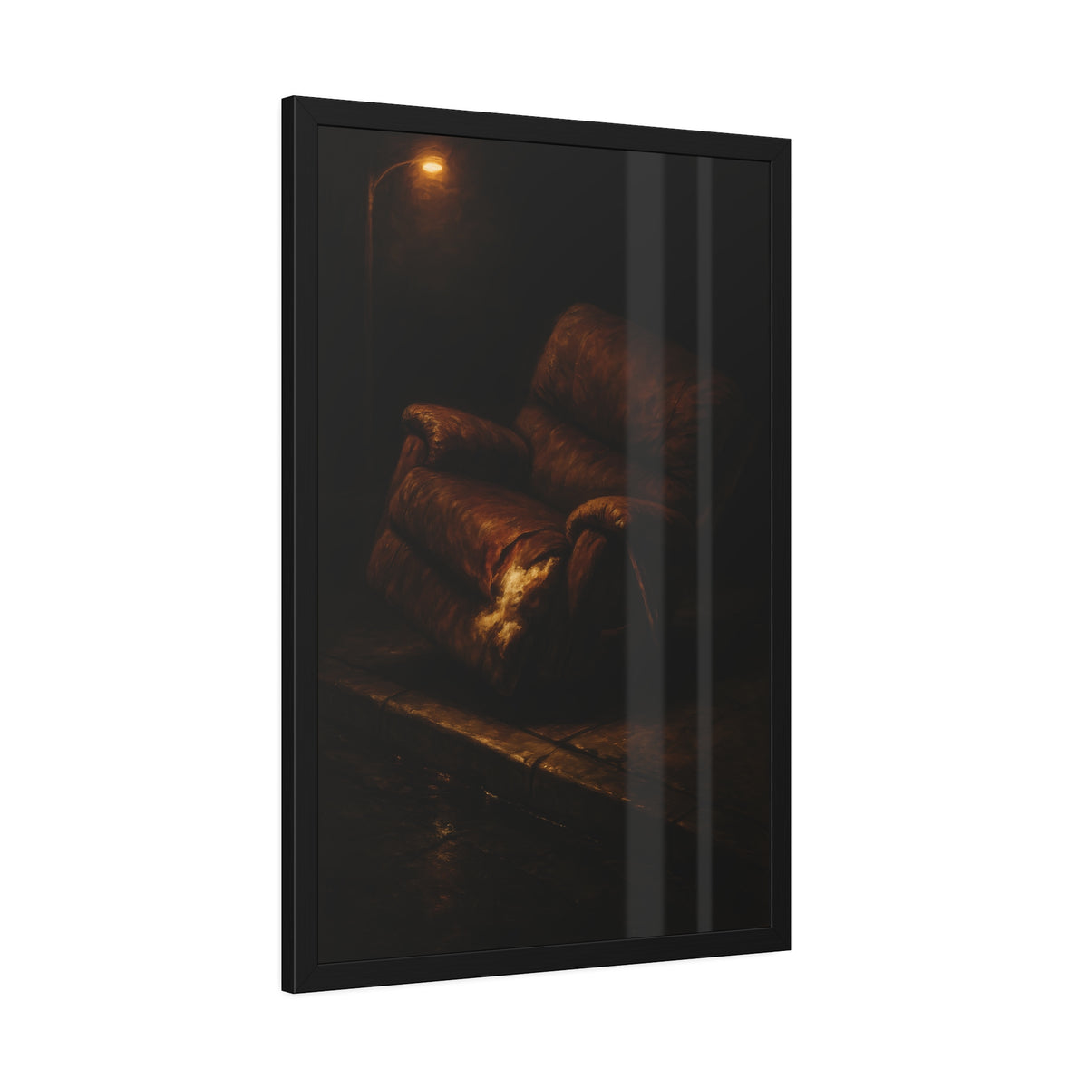 A torn brown recliner tipped on a curb in dim warm light. The Deposition of the Broken Recliner by Garabaggio, framed fine art print hanging in a room.
