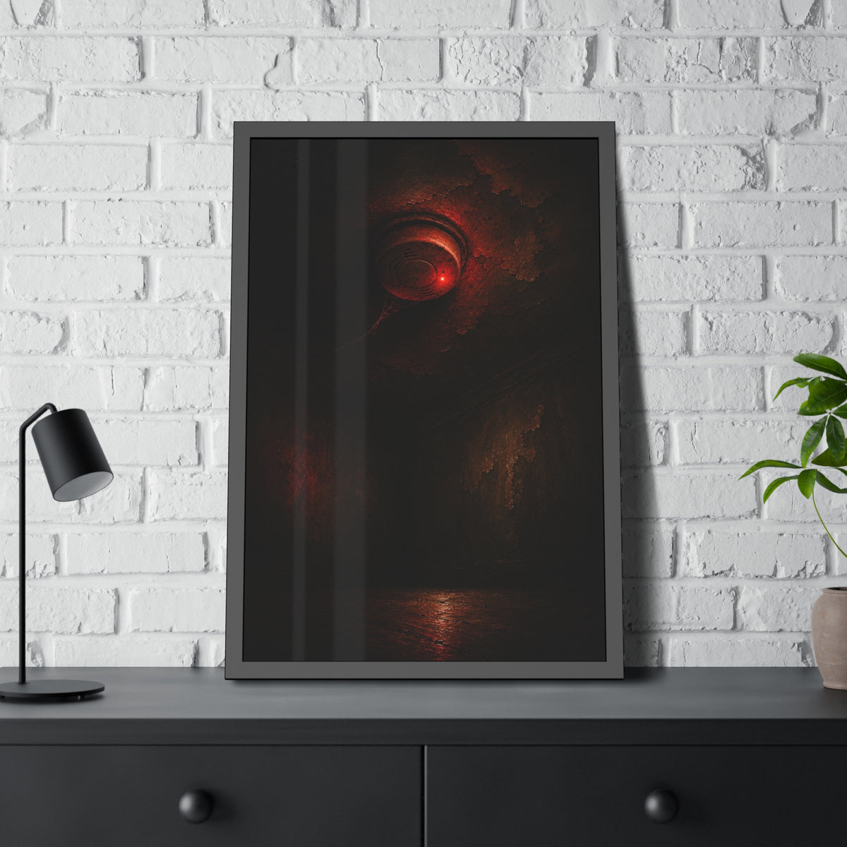 A ceiling smoke detector glowing red in an empty peeling room. The Alarm in an Empty Room by Garabaggio, framed fine art print hanging in a room.