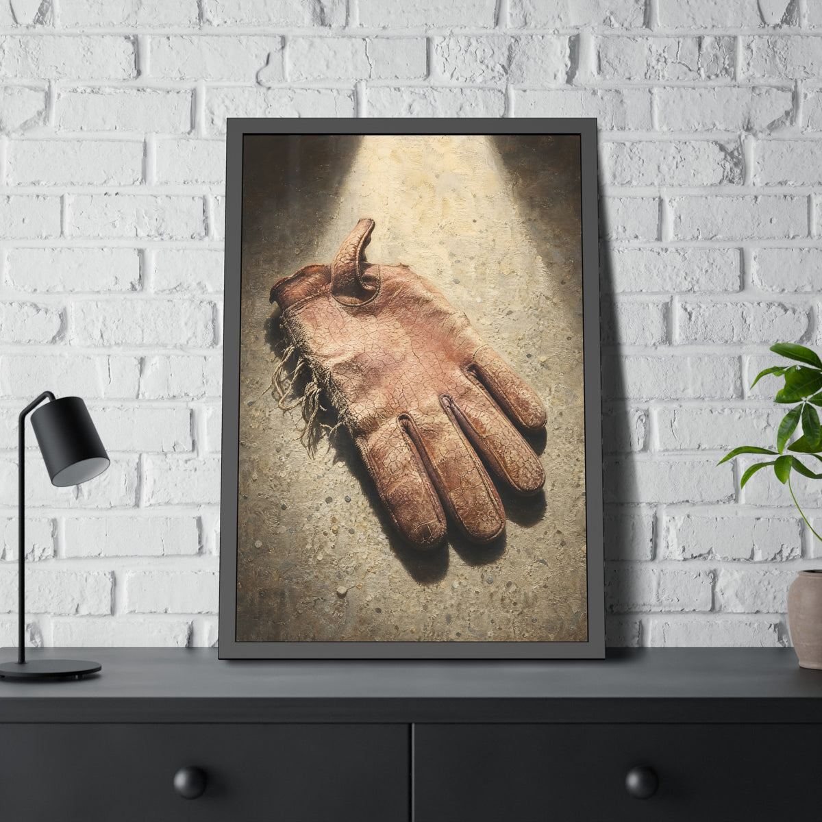 A cracked leather work glove lying on bright sunlit concrete. The Bleaching, Study of a Sun-Tired Glove by Garabaggio, framed fine art print hanging in a room.