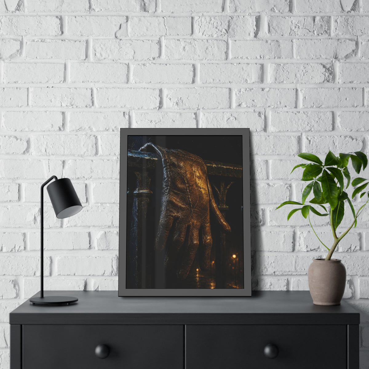 A leather glove draped over an iron railing, fingers hanging. The Repose of the Leather Glove, No. 1 by Garabaggio, framed fine art print hanging in a room.