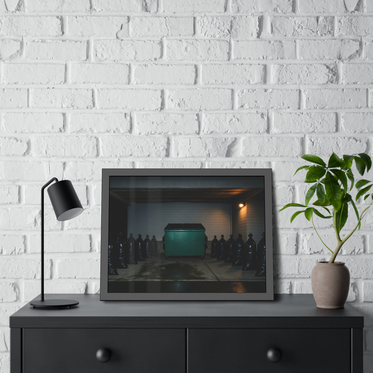 A green dumpster flanked by rows of black garbage bags under a lamp. Night Watch of the Loading Dock by Garabaggio, framed fine art print hanging in a room.