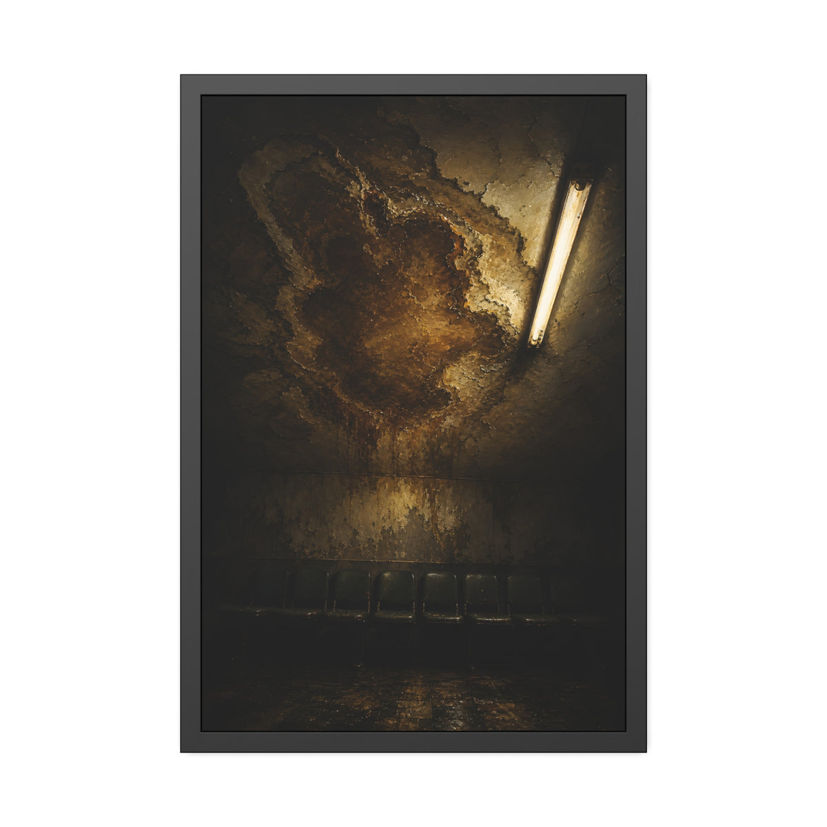 A brown water stain spreading across a ceiling above a row of chairs. The Stain Above the Row by Garabaggio, framed fine art print, 24″ x 36″.