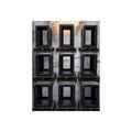 Nine empty black server racks on pallets in a wet lot at dawn. The Racks in the Morning Lot by Garabaggio, fine art print, 12″ x 16″.