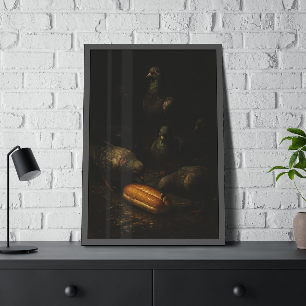 Pigeons crowding around a bread roll on dark stone paving. The Congregation at the Bun by Garabaggio, framed fine art print hanging in a room.