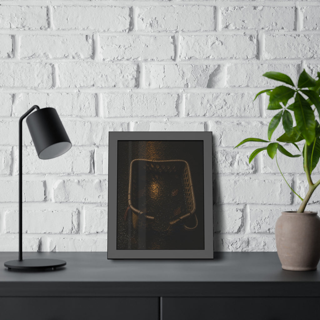 A cracked laundry basket holding rainwater and leaves on wet ground. The Basin of Rain (Laundry Basket) by Garabaggio, framed fine art print hanging in a room.