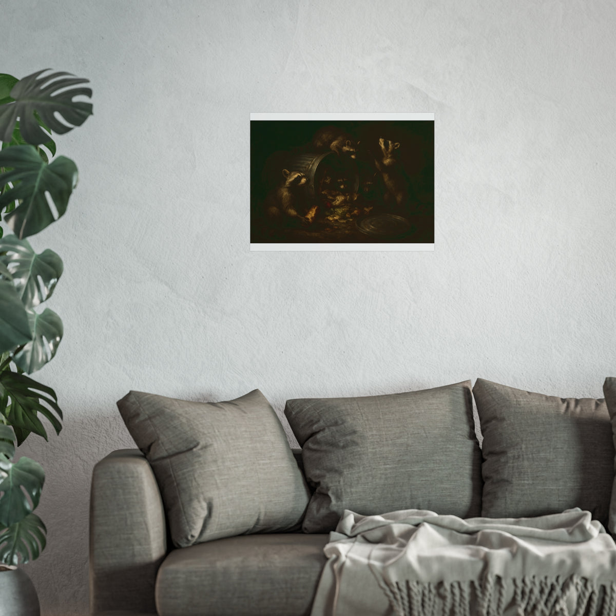Raccoons around a tipped metal trash can, scattering food scraps. The Vigil of the Midnight Feast by Garabaggio, fine art print hanging in a room.