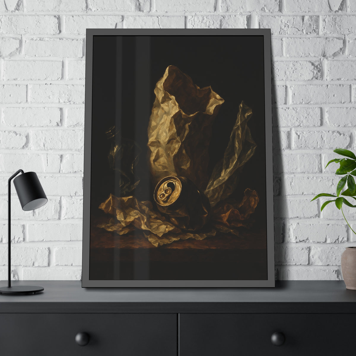A crushed paper bag, dented can and flattened bottle on a dark table. Vanitas with Crumpled Bag by Garabaggio, framed fine art print hanging in a room.