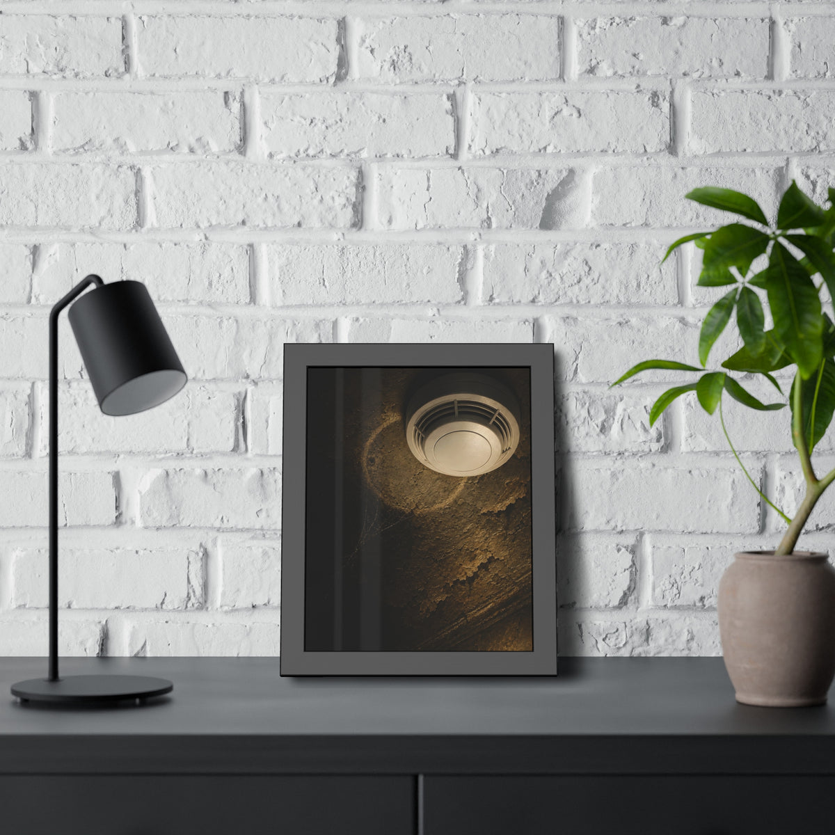 A new smoke detector on a stained ceiling next to an old mounting ring. The New Detector by Garabaggio, framed fine art print hanging in a room.