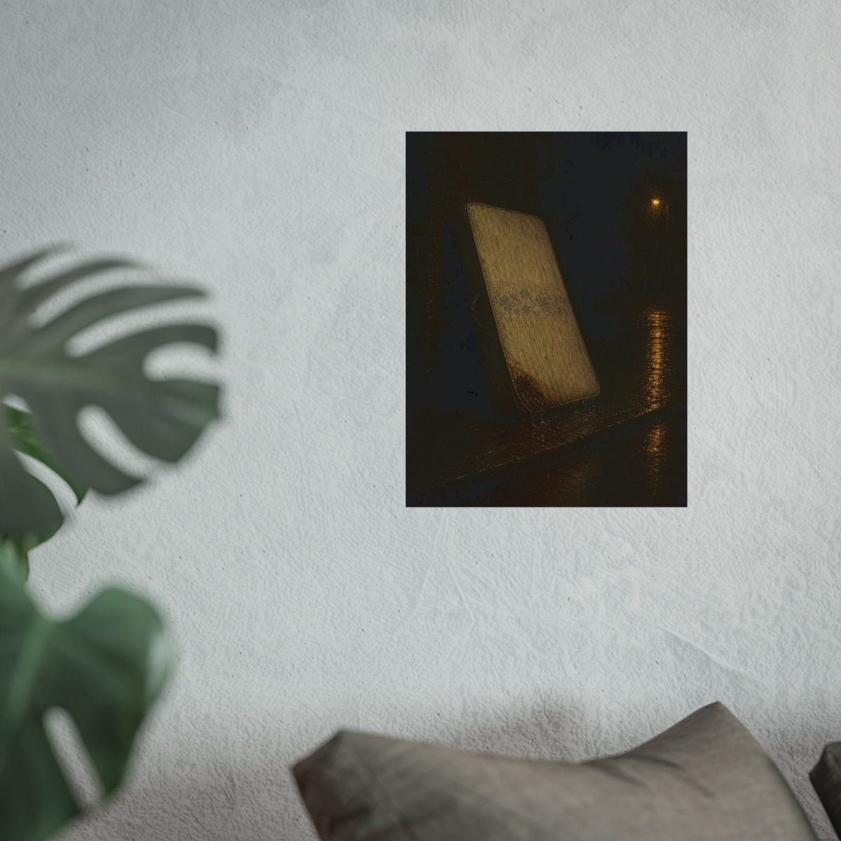 A stained mattress leaning against a wall in rain under a streetlamp. The First Rain by Garabaggio, fine art print hanging in a room.