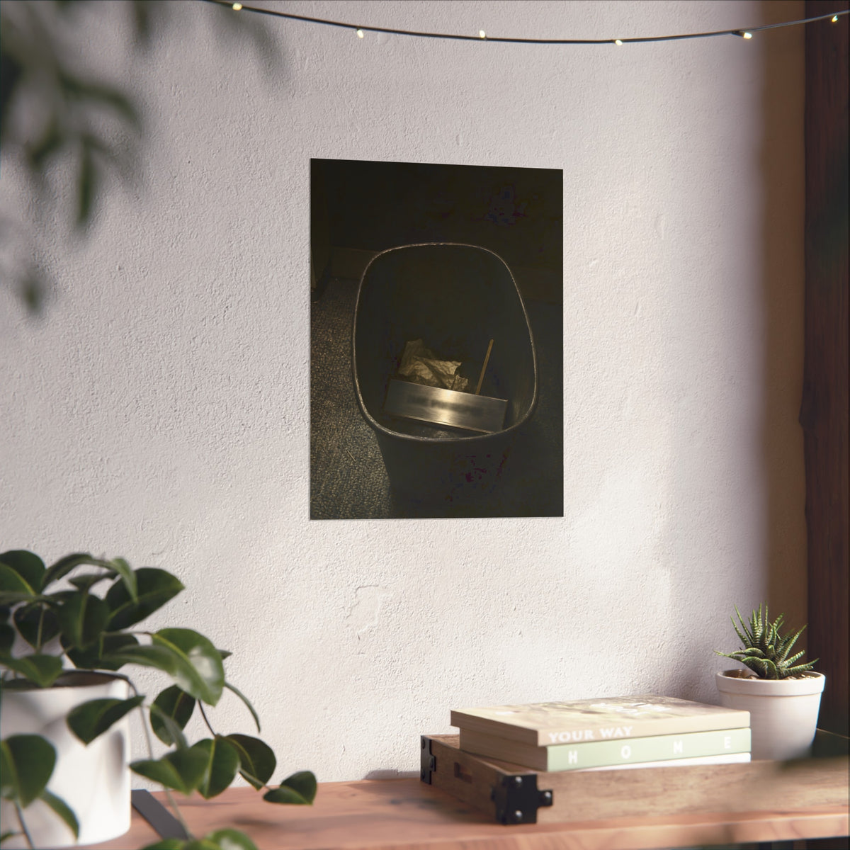 A metal nameplate lying in a black office waste bin on grey carpet. The Nameplate in the Waste Bin by Garabaggio, fine art print hanging in a room.