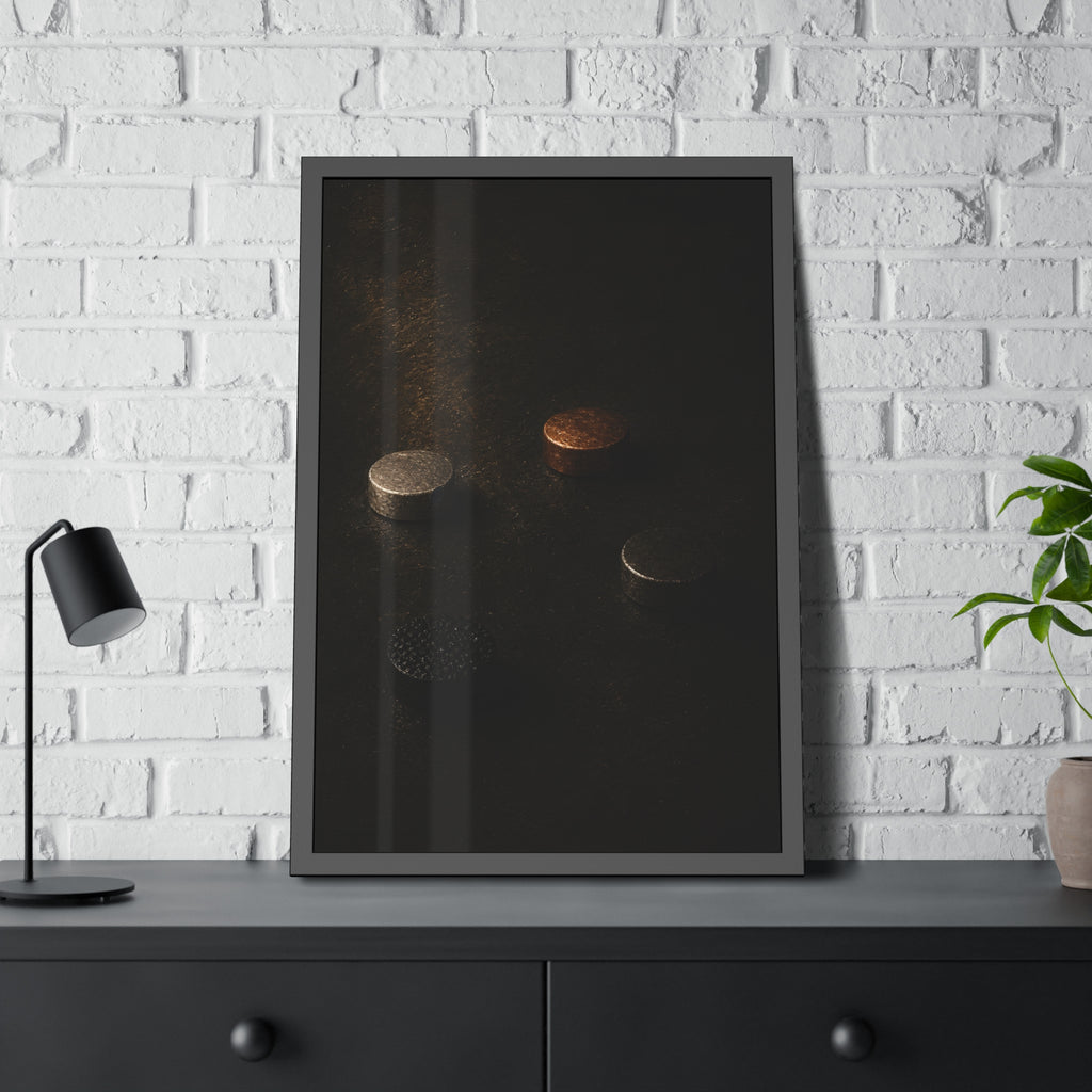 Four small metal discs on a dark scuffed surface in a narrow beam of light. Metals After the Song by Garabaggio, framed fine art print hanging in a room.