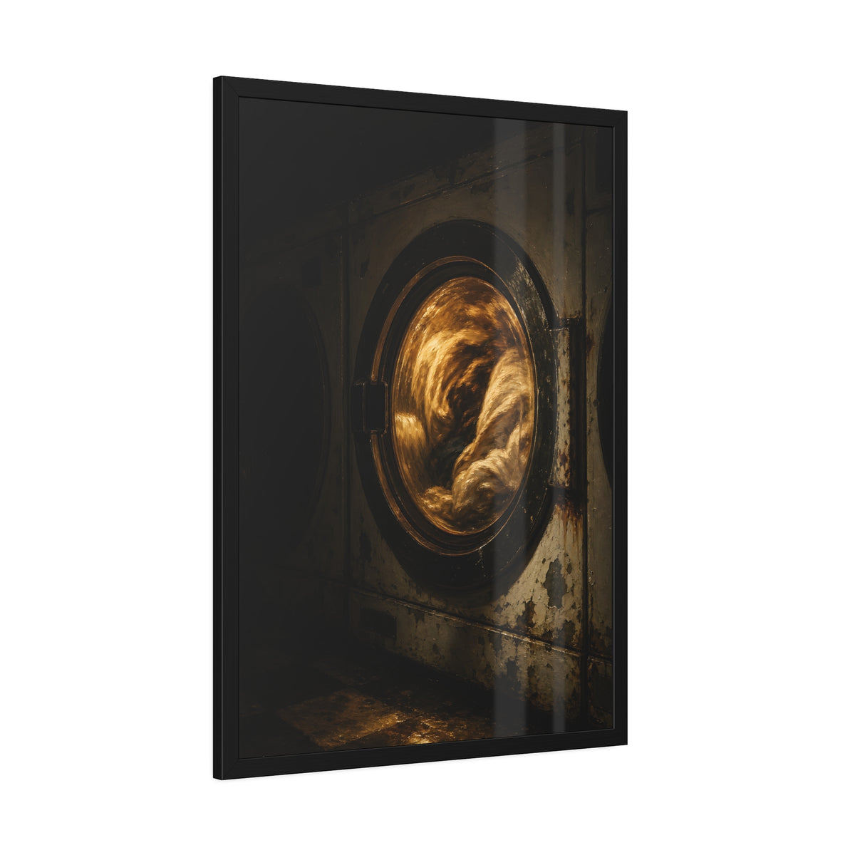 A washer drum tumbling laundry lit amber behind its glass door. The First Spin by Garabaggio, framed fine art print hanging in a room.