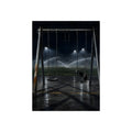 An empty swing set on wet asphalt, sprinklers arcing over the field. The Eleventh Hour: The Sprinklers by Garabaggio, fine art print, 12″ x 16″.